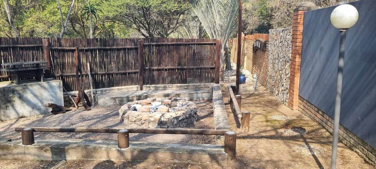 Boma with raised deck and stone fire pit